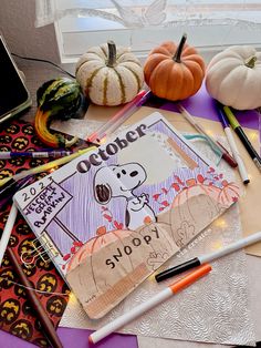 an assortment of crafting supplies including pumpkins, markers and paper with writing on them