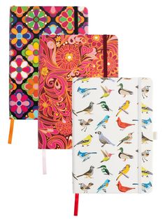 three notebooks with colorful birds on them