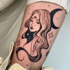 a woman with long hair and stars on her leg