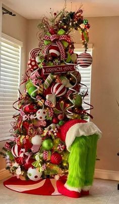 a christmas tree decorated with candy canes and ornaments