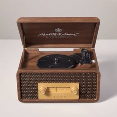 an old - fashioned record player with wooden case