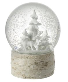 a snow globe with trees and animals in it