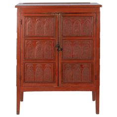 an old wooden cabinet with carvings on the front and side doors, isolated against a white background