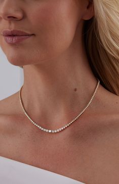 A graduating row of bezel-set diamonds illuminates your neckline with eternal shine on this brilliant necklace forged from 18-karat gold. 16" length; 1" removable extender Tongue-and-groove closures Total diamond weight: 4.47ct. Color: G–H Clarity: VS–SI 18k gold/diamond Imported >Diamond Guide Eternity Necklace, Diamond Guide, Bezel Set Diamond, Tongue And Groove, Diamond Eternity, Shine On, Clean Girl, G H, Bling Bling