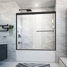 a bathroom with a shower, toilet and sink in it's corner area that has a rug on the floor