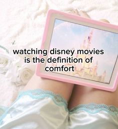 someone is watching disney movies on their tablet computer with the caption saying, watching disney movies is the definition of comfort