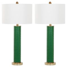 two green lamps with white shades on them