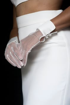 These gloves are crafted from high-quality semi-sheer mesh and adorned with a satin cuff. I am incredibly proud of their quality, as we have spent quite a lot of time developing and launching this model - every detail matters. Trust me, you'll want to keep this pair of gloves as an heirloom and pass it down to future generations. INFORMATION: Сolor: Ivory Material: Sheer Tulle and Satin Terms for production: 1 week Packaging: Fabric pouch and cardboard box Production: 100% handmade LGBT-friendly We tailor gloves to order, so measuring your palm parameters is necessary for placing an order. You can do it later, after placing the order.  If you wish to give gloves as a gift and are unable to obtain measurements, it is possible to do so provided that you have a photo of the person and knowled Haute Couture Gloves, Tulle Fingerless Gloves Wedding, White Gloves Wedding, White Tulle Gloves, White Hand Gloves, White Elegant Gloves, White Pearl Gloves, Bride Gloves, White Lace Gloves