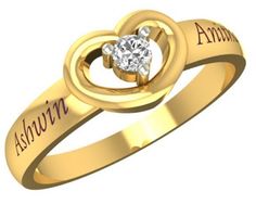 a gold ring with two hearts on it and the words,'love is in the air