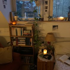 a bedroom with a bed, bookshelf and lamp in the corner next to it