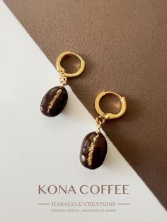 Real coffee earrings/Handmade jewelry/Thanksgiving gift/Christmas gift jewelry/resin earrings /birthday gift/autumn limited earrings/fall jewelry/winter jewelry - Materials: Real Kona coffee beans, eco friendly resin, 18k gold plated earring hardware - Features:  Original design, hypoallergenic, tarnish resistant, handmade in Hawaii - Size: the huggie hoops are 14mm (0.55inch) Indulge in a daily dose of caffeine-inspired elegance with our Real Kona Coffee Bean Stud Earrings. Each pair features real Kona coffee beans, handpicked from Hawaii's famous coffee fields, and transformed into a unique and sophisticated piece of wearable art. 🌺 Distinctive Design: My original, one-of-a-kind design showcases the natural beauty of the coffee bean. The middle of each bean, where it's divided by a char Handmade Coffee Colored Jewelry For Gifts, Handmade Coffee-colored Jewelry For Gift, Polymer Clay Coffee Bean Earrings, Coffee Earrings, Coffee Bean Necklace, Coffee Earring, Coffee Bean Earrings, Real Coffee, Winter Jewelry