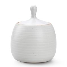 a white ceramic jar with a brown stripe on the top and bottom, sitting in front of a white background