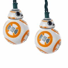 two star wars ornament ornaments are hanging from strings on a white background in the shape of bb - 8