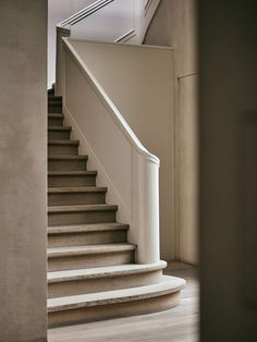 an empty staircase leading up to the second floor