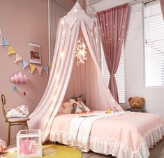 a child's bedroom decorated in pink and white