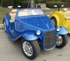 two children's cars are parked on the street