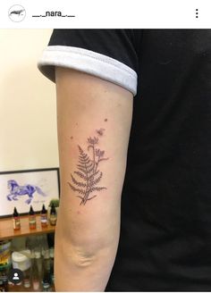 a person with a tattoo on their arm