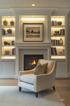 a white chair sitting in front of a fire place with bookshelves behind it