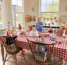 a little boy that is sitting at a table