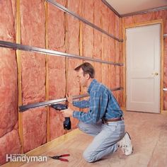 a man is working on the insulation in his house