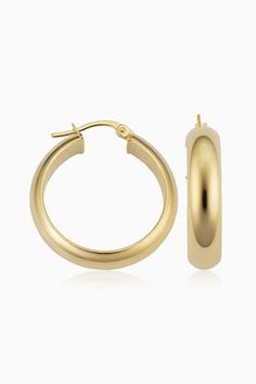 Radiant. Bold. Timeless. Our High Society Large Hoops are the statement earrings every fine jewelry collection needs. The wide, flattened solid gold tubes give them a classic, vintage feel, while the curved design creates a dome effect for maximum shine. Metal: 14 Karat Yellow Gold Dimensions: 6mm Width, 20mm Inner Diameter Construction: Solid Gold Tubing, Latch Closure Weight: 3 Grams Origin: Crafted in Arezzo, Italy Classic Gold-tone Tarnish Resistant Hoop Earrings, Classic Gold Plated Polished Hoop Earrings, Classic Gold Plated Hoop Earrings With Polished Finish, Elegant Polished Yellow Gold Hoop Earrings, Elegant Yellow Gold Hoop Earrings With Polished Finish, Elegant Yellow Gold Polished Hoop Earrings, Classic Gold Tarnish Resistant Hoop Earrings, Classic Gold Tarnish-resistant Hoop Earrings, Classic Gold-tone Earrings For Formal Occasions