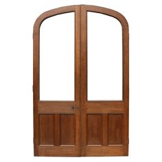 a wooden double door with arched glass and wood paneling on the sides, against a white background