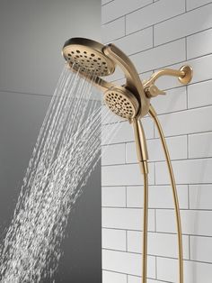 the shower head is open with water coming from it