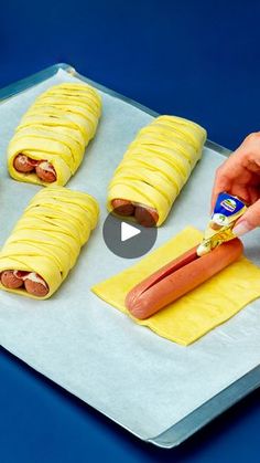 a person is cutting up some food on a tray