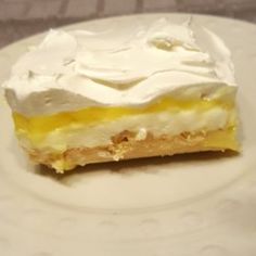 a piece of lemon meringue pie on a white plate