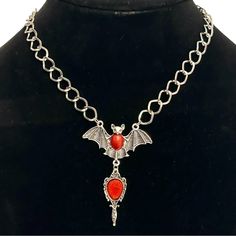 20% Off Bundles! New Without Tags. No Flaws. See Images For Details. Brand: Unknown Item: Necklace Shape: Bat Size: 15”-17” Drop: 2.75” Color: Silver Closure: Lobster Material: Silver-Tone Metal Please Ask All Questions Before Purchasing. Red Gothic Metal Necklace, Elegant Red Jewelry For Halloween, Gothic Red Necklace With Chain, Red Gothic Chain Necklace, Gothic Red Chain Necklace, Red Metal Jewelry With Silver Chain, Gothic Red Nickel-free Necklace, Red Gothic Nickel-free Necklace, Red Gothic Necklace Nickel Free