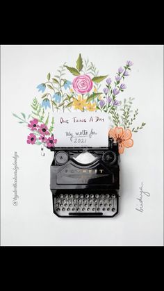 an old fashioned typewriter with flowers on it