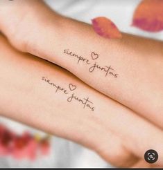 two girls with matching tattoos on their arms that say, someone loves you so much