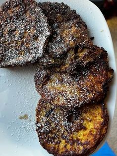 three pieces of french toast on a white plate