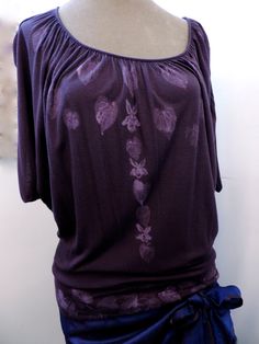 "Pale lavender prints of heart shaped violet leaves and flowers decorate this aubergine blouse. Instead of cluster the violets and leaves together like they grow, Because of the form of this shirt I have decorated it with leaves and flowers as if they were a necklace on this blouse. \"Violets on Aubergine\" is the result. Violets leaves were printed and violet flowers hand painted in an arrangement resembling a necklace on this super lightweight Mossimo blouse of 100% rayon. A row of violet leav Violet Leaves, Violet Flowers, Pale Lavender, Eggplant Color, Comme Si, Dusty Purple, Eco Printing, Purple Blouse, Violet Flower