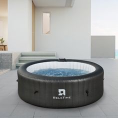 an inflatable hot tub sitting on the ground