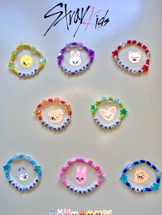 a bunch of different colored hair clips on a white surface with the word spring written in it