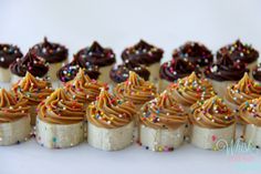 there are many cupcakes with chocolate frosting and sprinkles on them