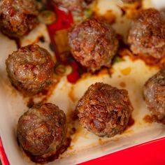 some meatballs in a red and white dish