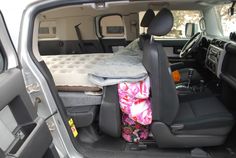 the back seat of a vehicle with an inflatable mattress