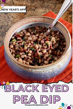 black - eyed pea dip in a bowl with spoon and orange napkin on the side