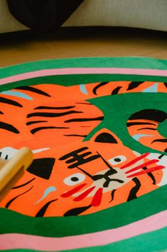 a close up of a tiger rug on the floor