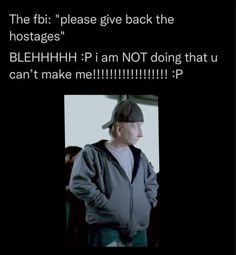 a man wearing a baseball cap standing in front of a black background with the caption'the fib please give back the hostages '