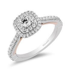 a diamond engagement ring with two rows of diamonds on the band and an halo setting