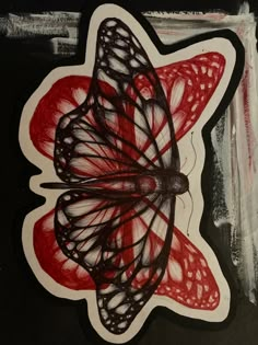 a drawing of a butterfly on top of a red and black piece of paper with white writing