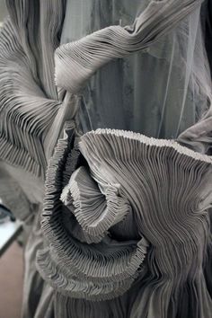 an artistic sculpture made out of pleated material