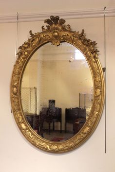 a large mirror hanging on the wall