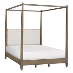 a four poster bed with white linens on the bottom and headboard is shown