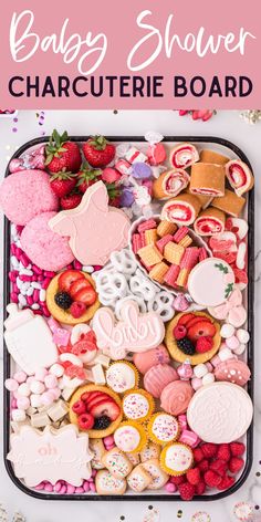 baby shower charure board with pink and white cookies, strawberries, cupcakes, strawberry shortbreads on it