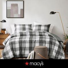 a black and white checkered comforter on a bed