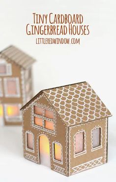 two cardboard gingerbread houses sitting next to each other with the words tiny cardboard gingerbread houses lit up